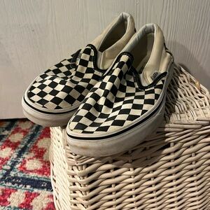 Size 5.5 Men/7 Women’s. White and black checkered vans slip on sneakers.